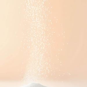 white powder sprinkling into a pyramid